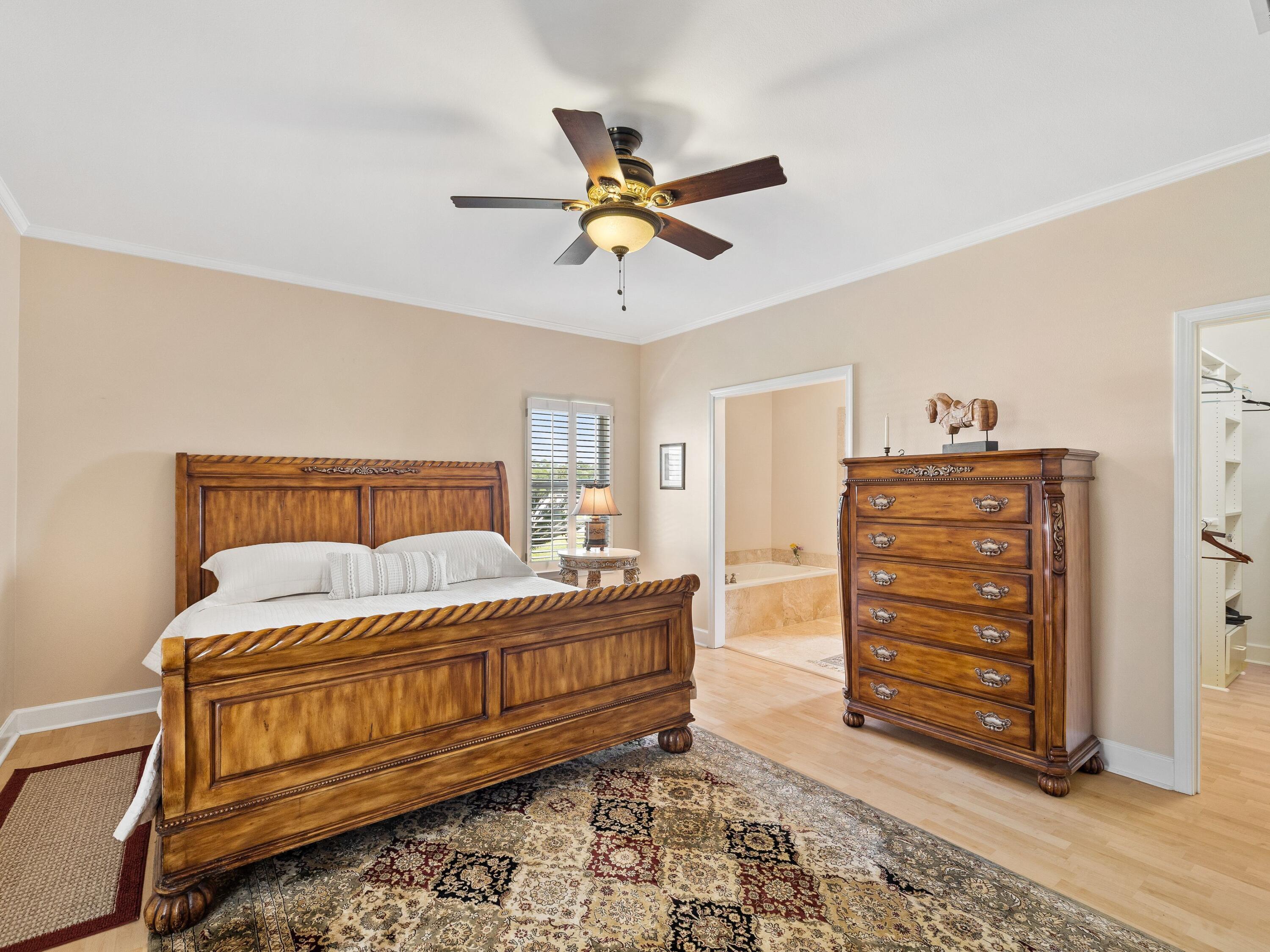 5676 Highway 2 DeFuniak Springs, FL 32433 - Photo 15 of 42 a bedroom with a bed and a dresser