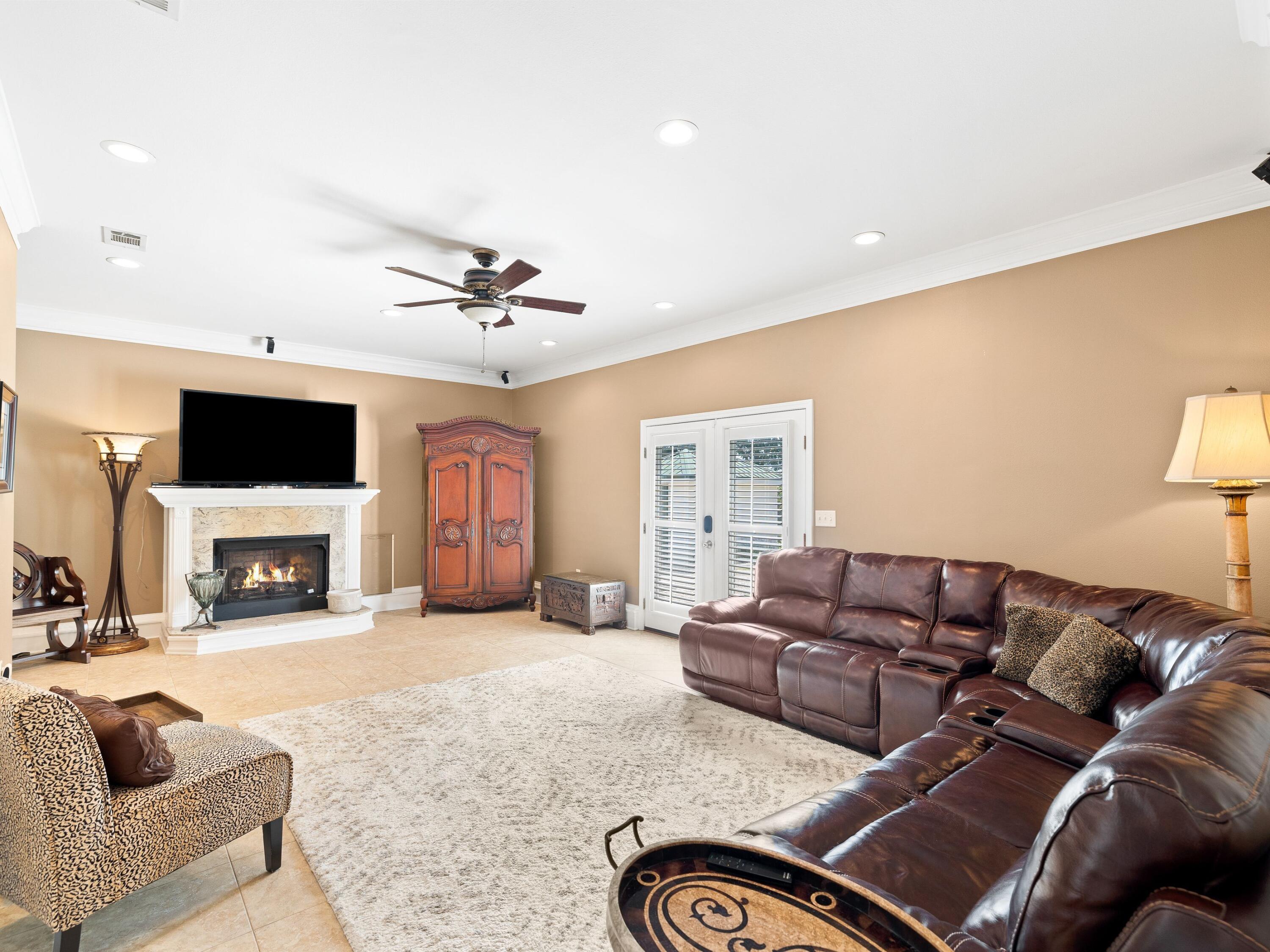 5676 Highway 2 DeFuniak Springs, FL 32433 - Photo 19 of 42 a living room with furniture fireplace and flat screen tv