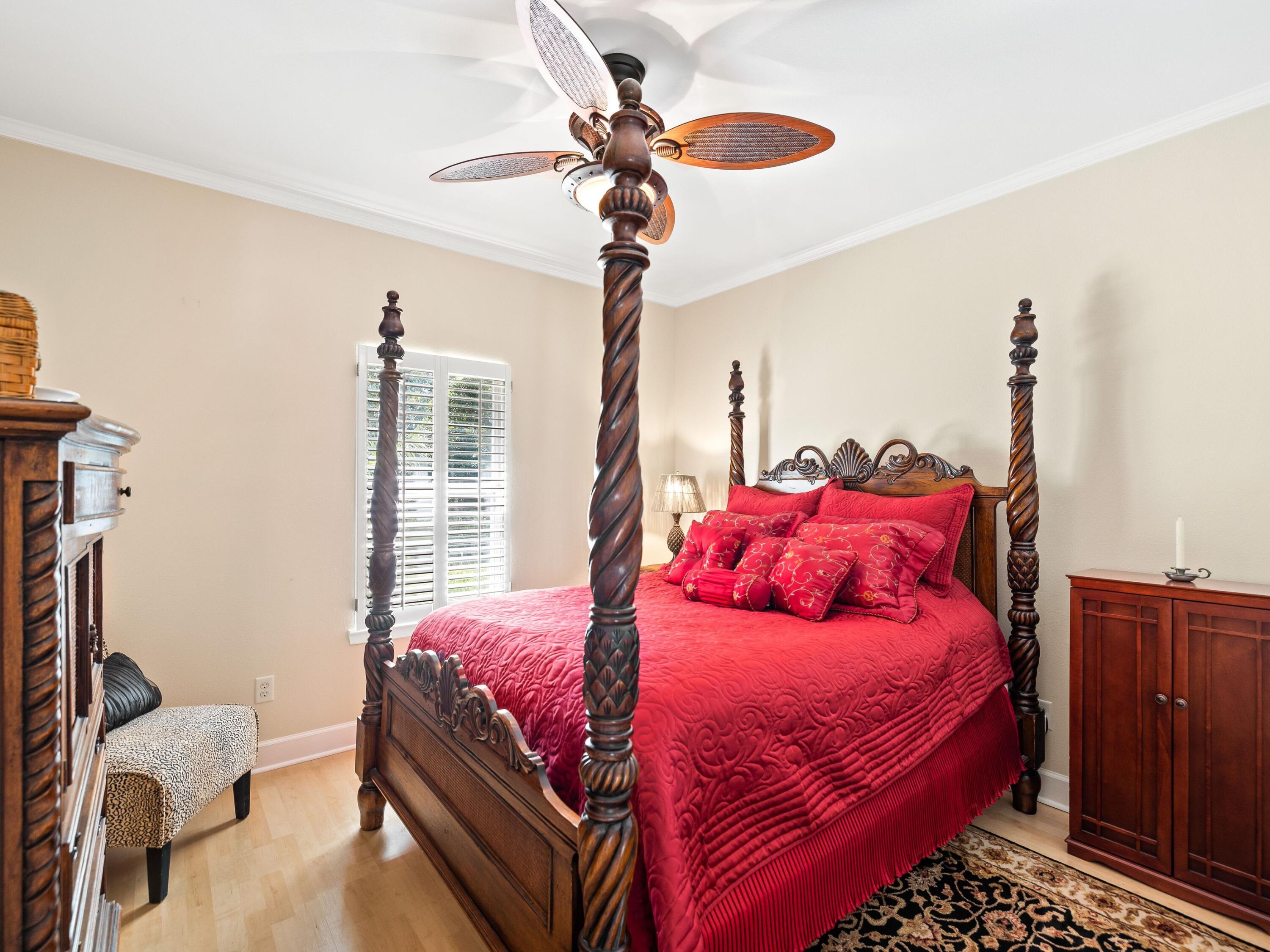 5676 Highway 2 DeFuniak Springs, FL 32433 - Photo 20 of 42 a bedroom with a bed and a chandelier