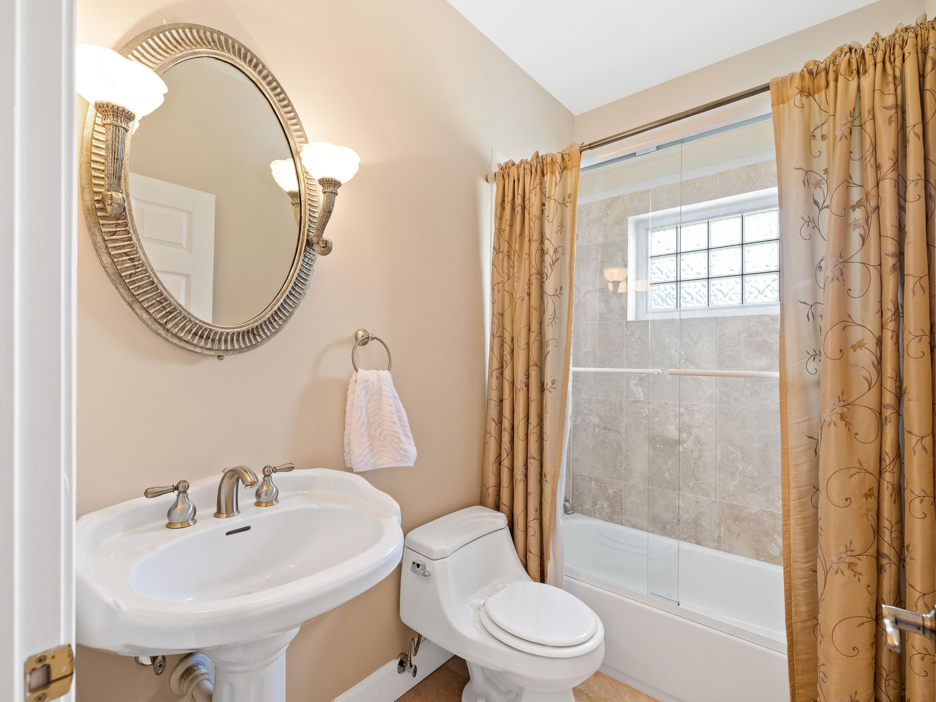 5676 Highway 2 DeFuniak Springs, FL 32433 - Photo 21 of 42 a bathroom with a sink toilet and shower