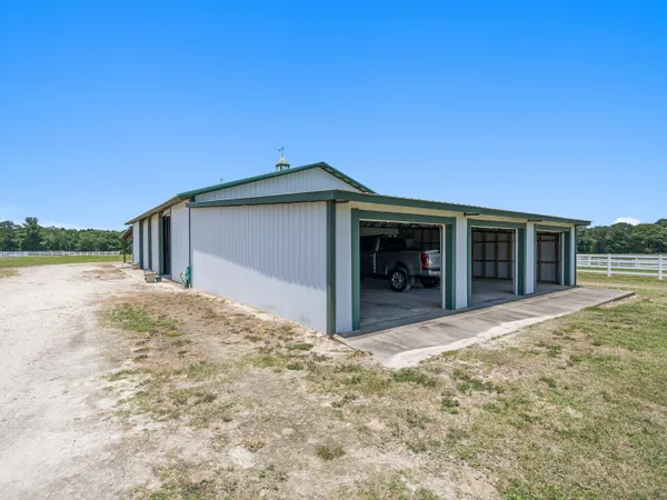 a view of a garage with parked cars