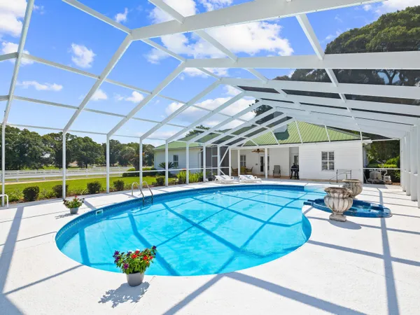 a view of a swimming pool with a patio