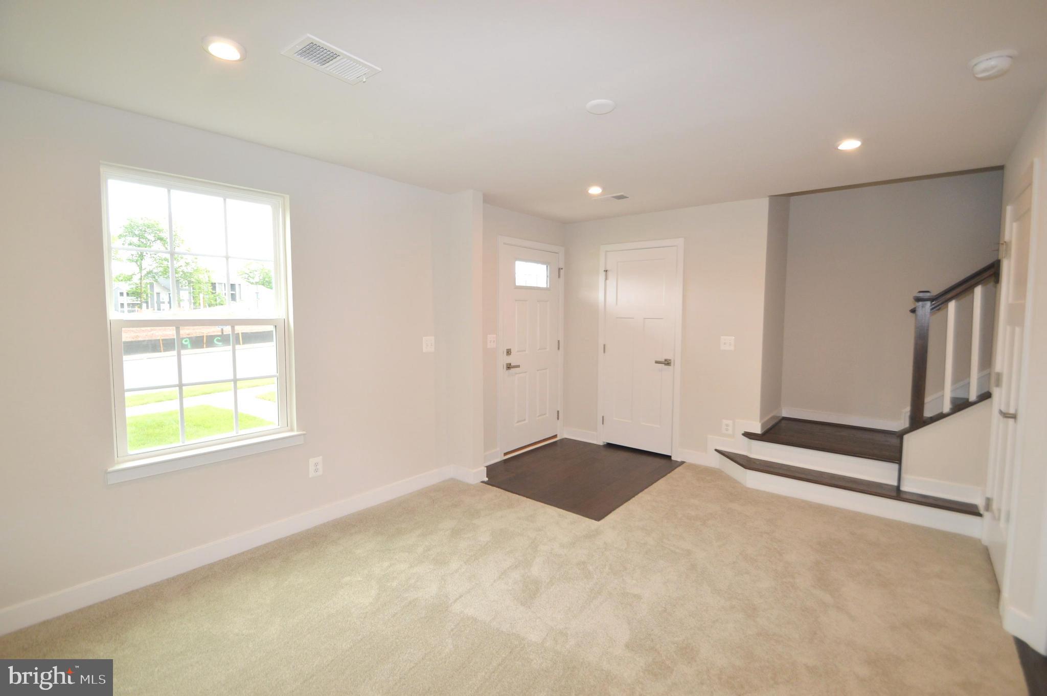 11448 Willow Green Circle Manassas, VA 20109 - Photo 4 of 26 a view of an empty room with a window