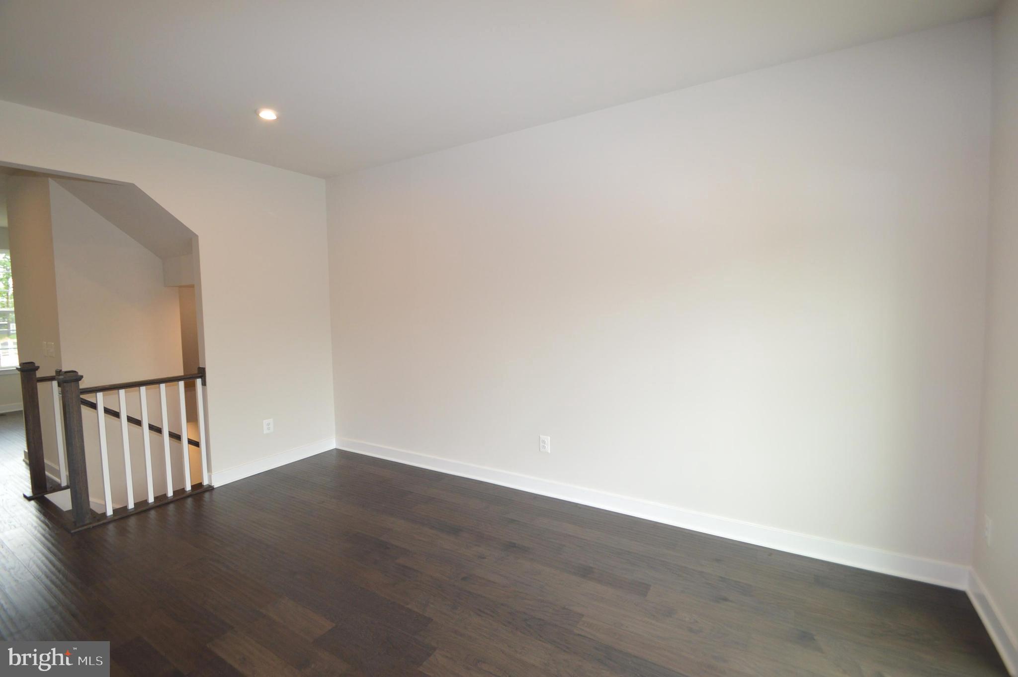 11448 Willow Green Circle Manassas, VA 20109 - Photo 10 of 26 a view of an empty room with wooden floor