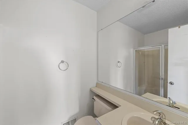 a bathroom with a sink and toilet