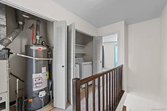 a view of a hallway with paintings on the wall