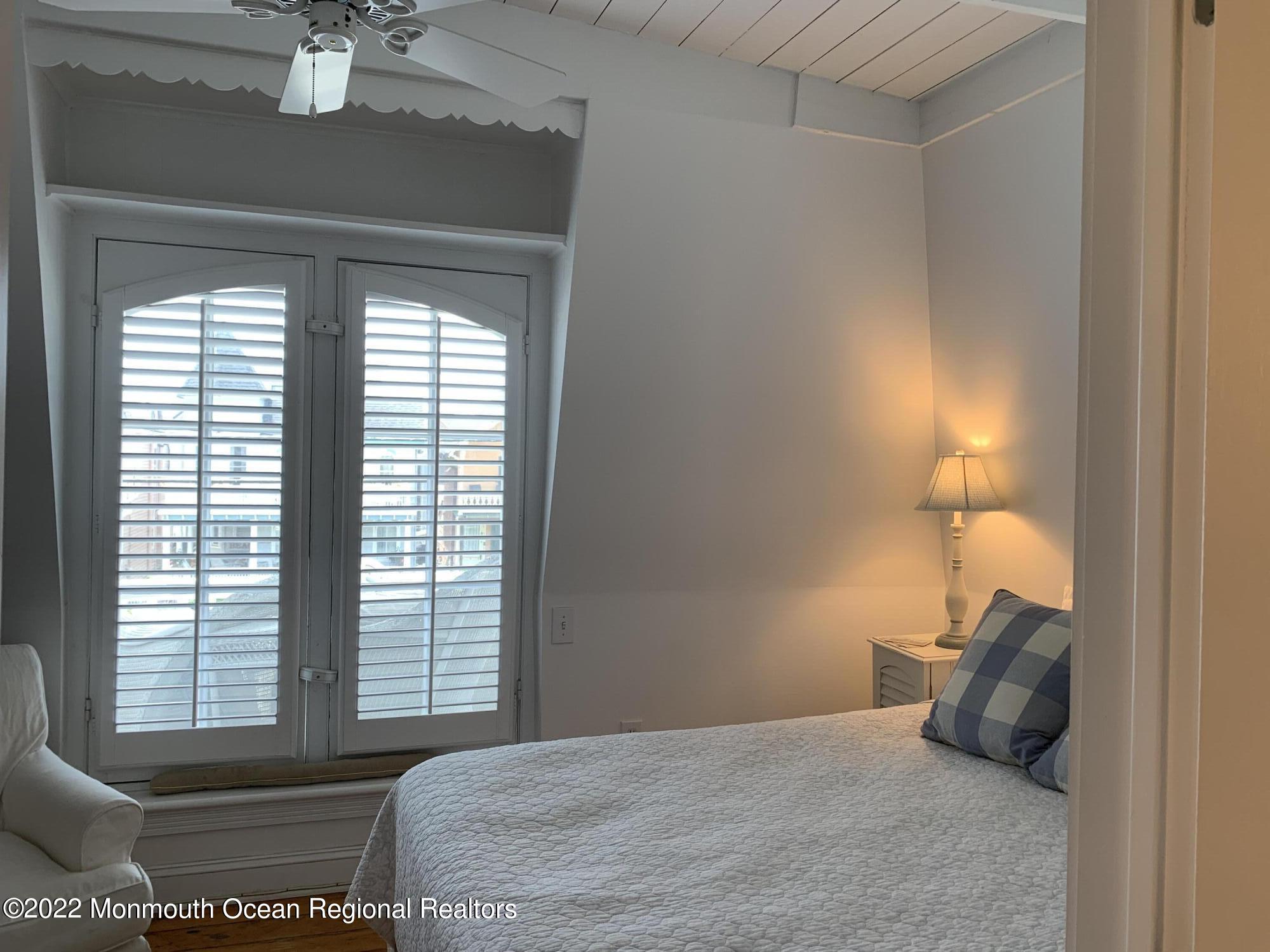 13 Heck Avenue Ocean Grove, NJ 07756 - Photo 11 of 25 a bedroom with a bed and window