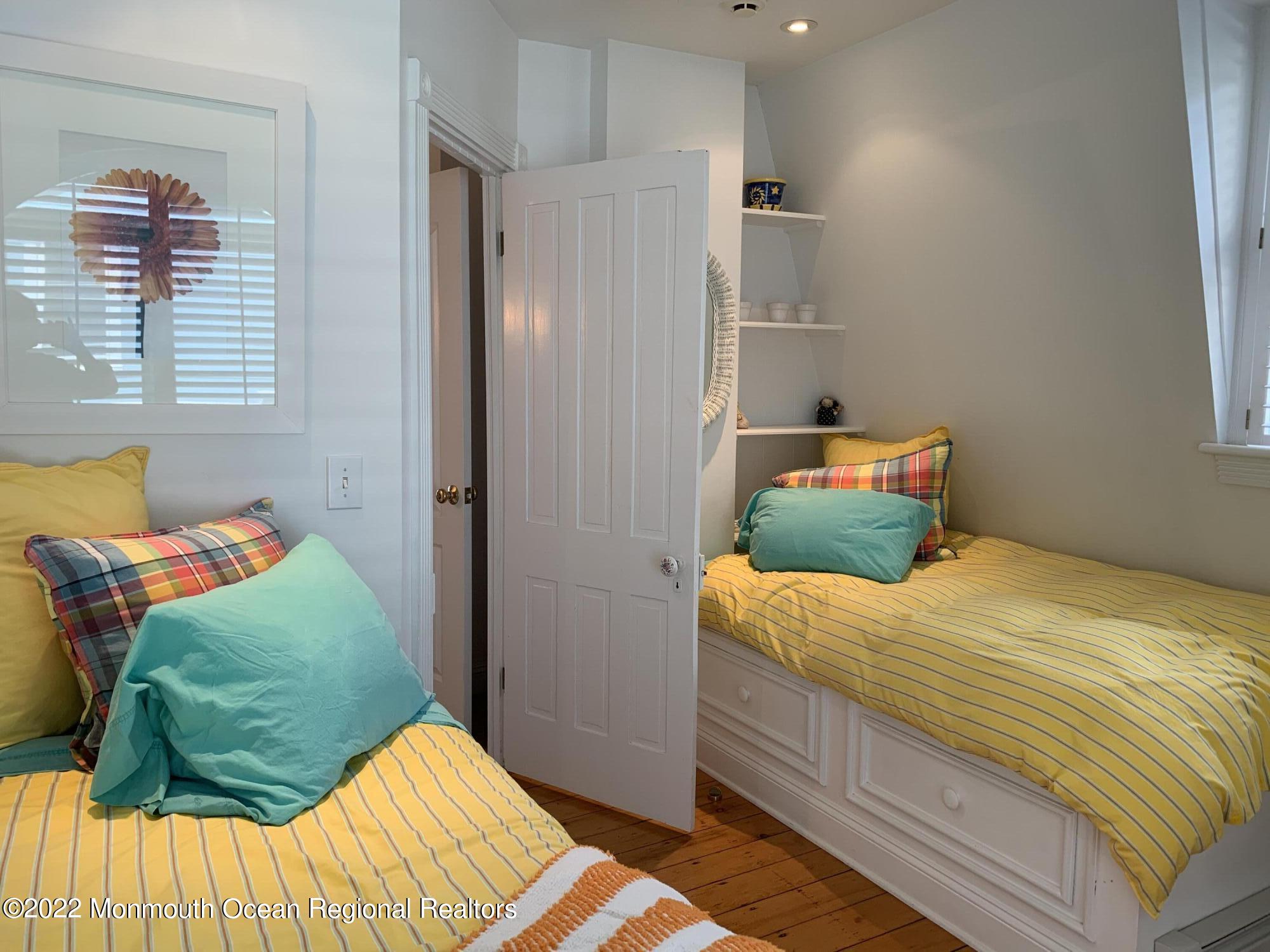 13 Heck Avenue Ocean Grove, NJ 07756 - Photo 13 of 25 a bedroom with a bed and a window
