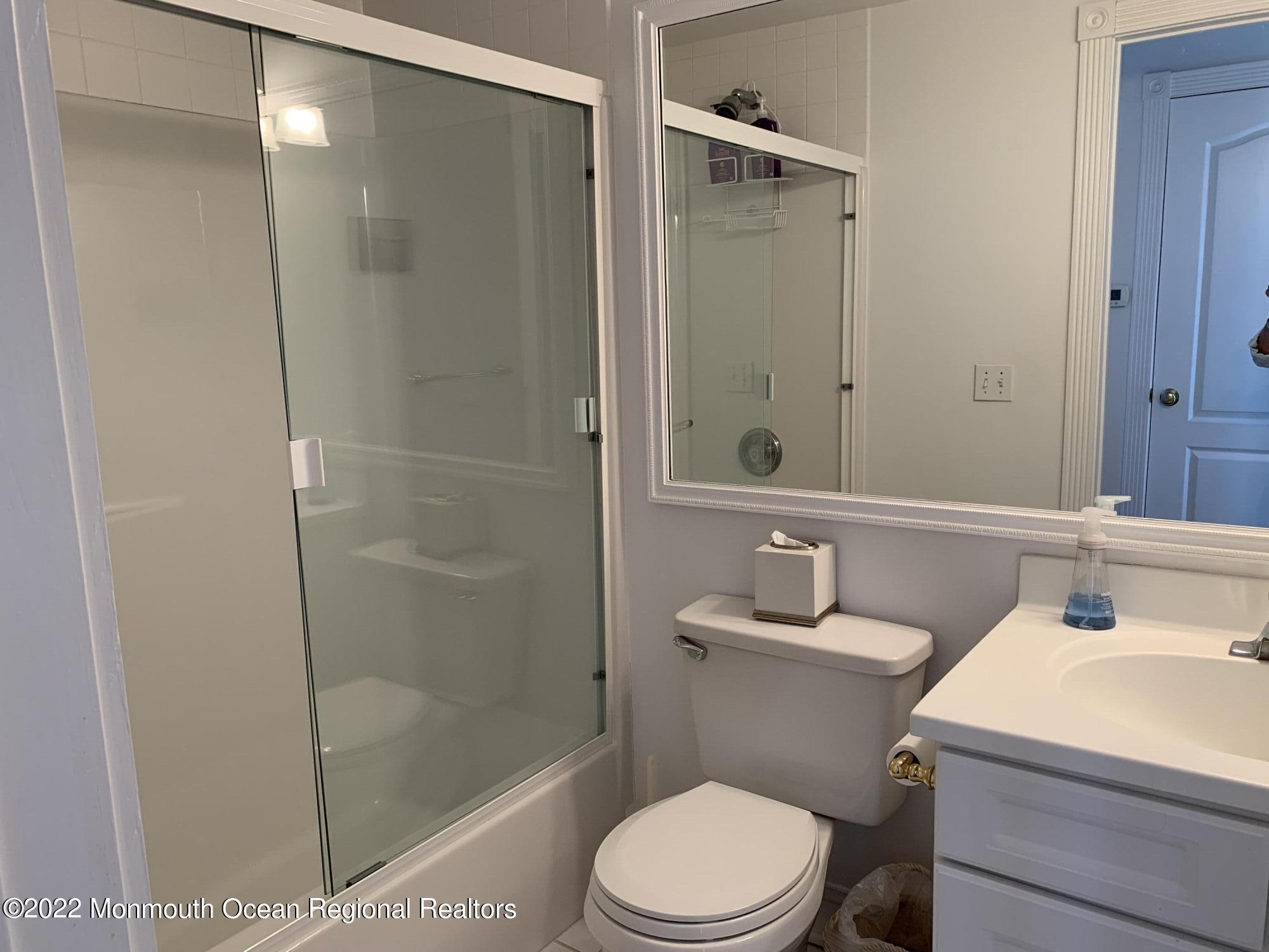 13 Heck Avenue Ocean Grove, NJ 07756 - Photo 20 of 25 a bathroom with a sink toilet and shower