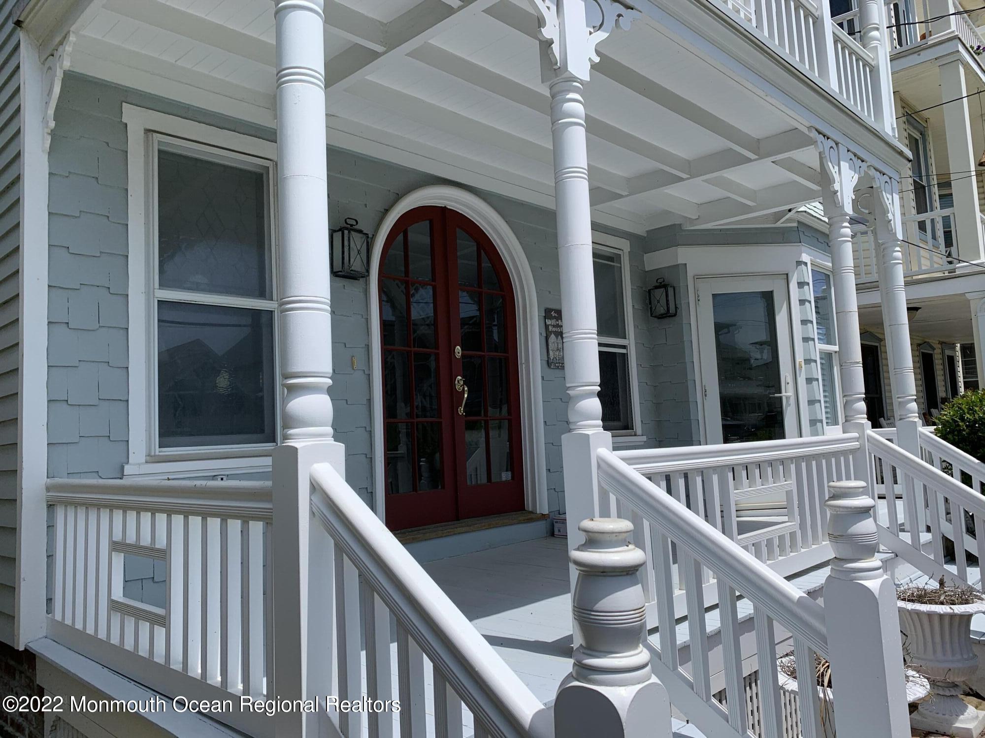 13 Heck Avenue Ocean Grove, NJ 07756 - Photo 2 of 25 a view of staircase with railing and a chandelier