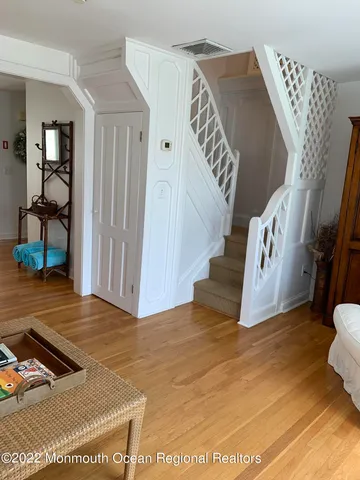 a view of an entryway with wooden floor