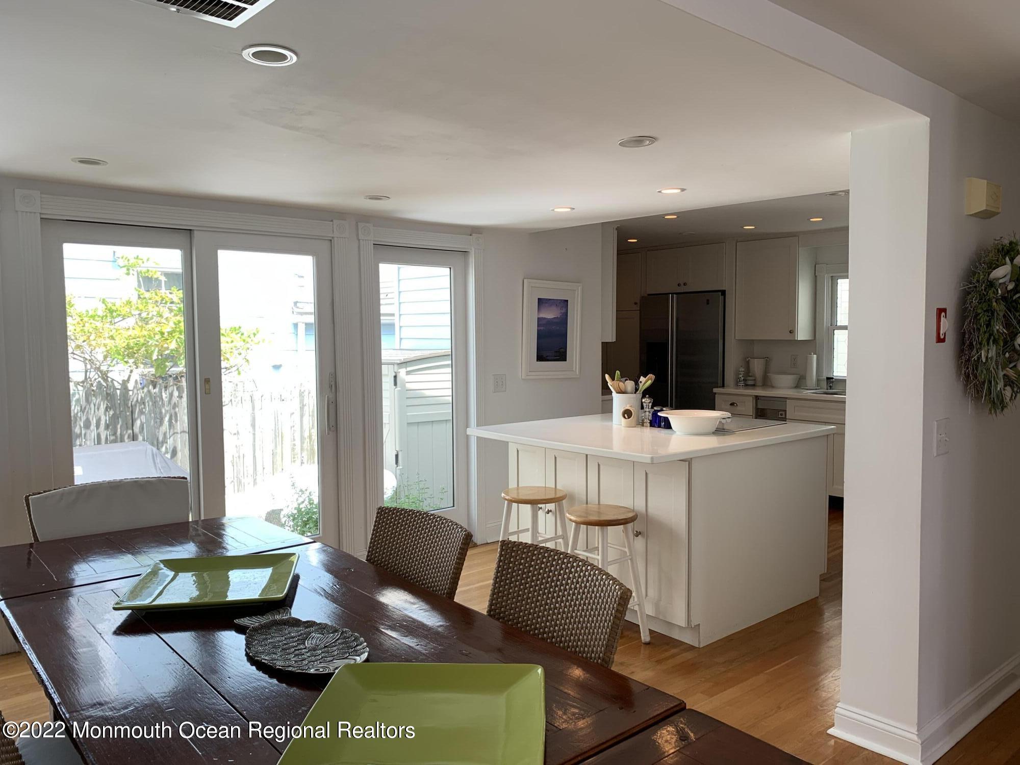 13 Heck Avenue Ocean Grove, NJ 07756 - Photo 8 of 25 a living room with furniture and a large window