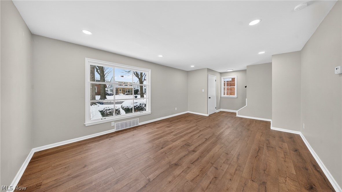 16811 Invermere Avenue Cleveland, OH 44128 - Photo 16 of 47 Unfurnished room with wood-type flooring, recessed lighting, and a smoke detector
