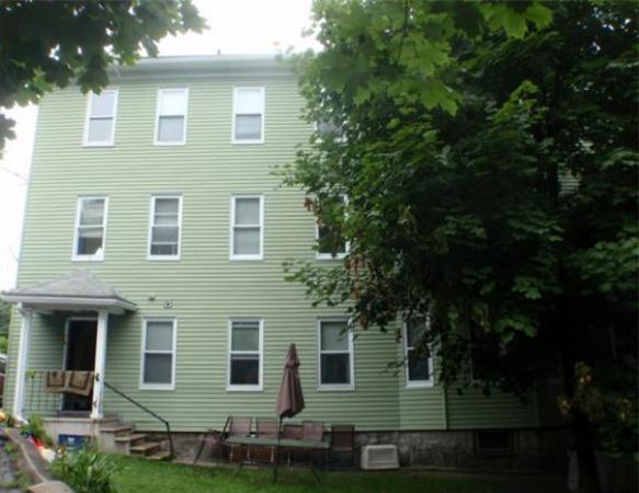 6 Malmo Street Worcester, MA 01607 - Photo 2 of 10 a front view of a house with plants