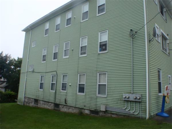 6 Malmo Street Worcester, MA 01607 - Photo 4 of 10 a view of a house with a yard and sitting area