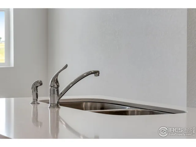 a kitchen with white cabinets