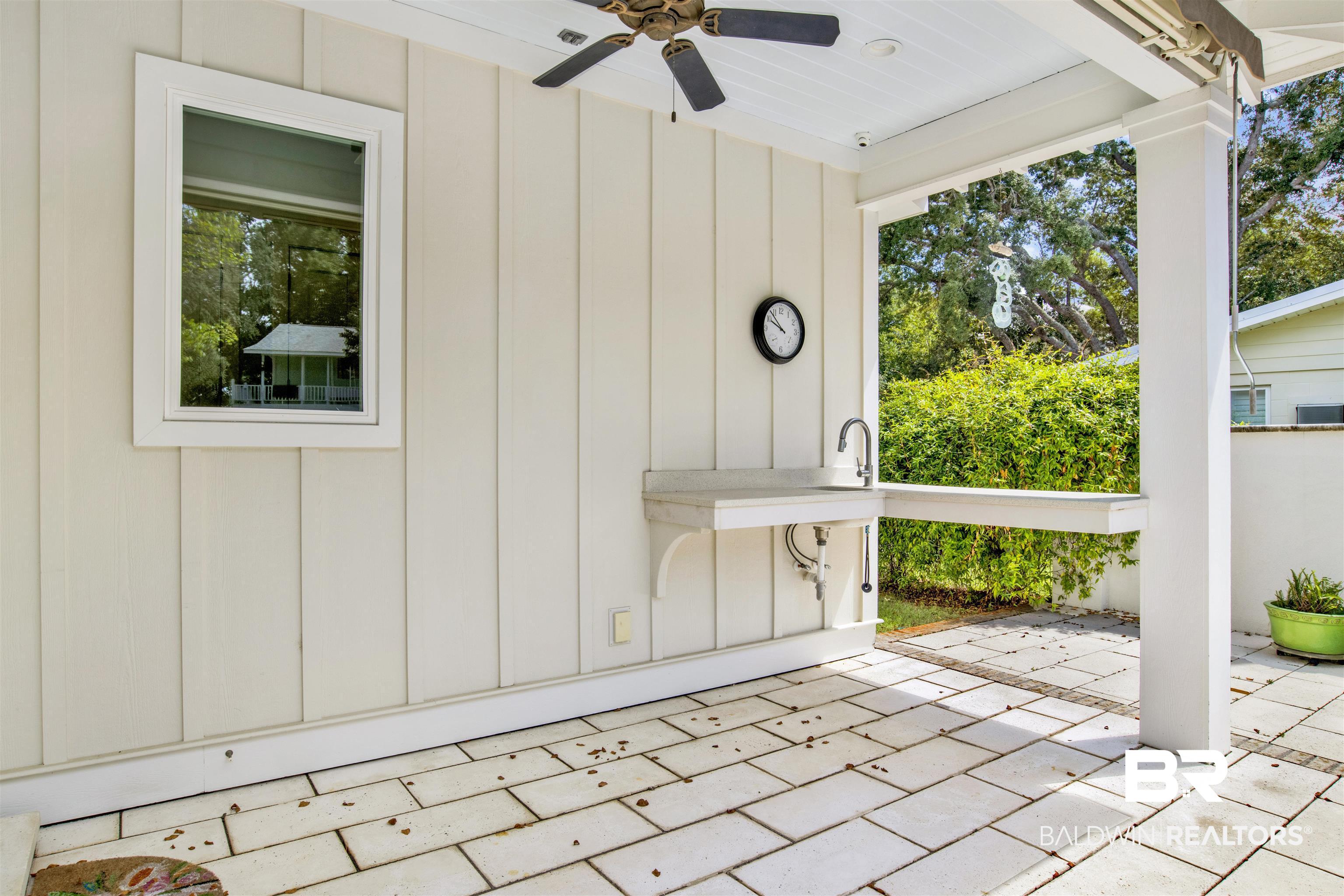 27980 Canal Road Orange Beach, AL 36561 - Photo 12 of 46 View of patio featuring a ceiling fan and a sink