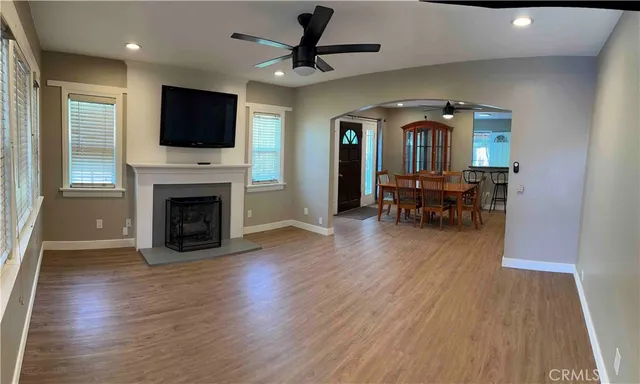a view of livingroom with furniture fireplace and wooden floor