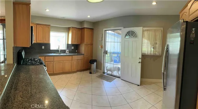 a large bathroom with a glass door shower and sink
