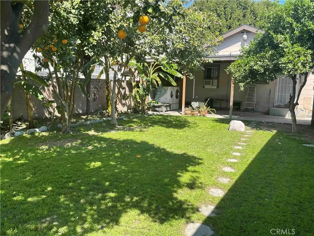 a swimming pool with outdoor seating and yard