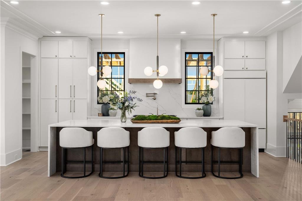 257 Lask Lane Milton, GA 30004 - Photo 14 of 84 a view of kitchen with dining table and chairs