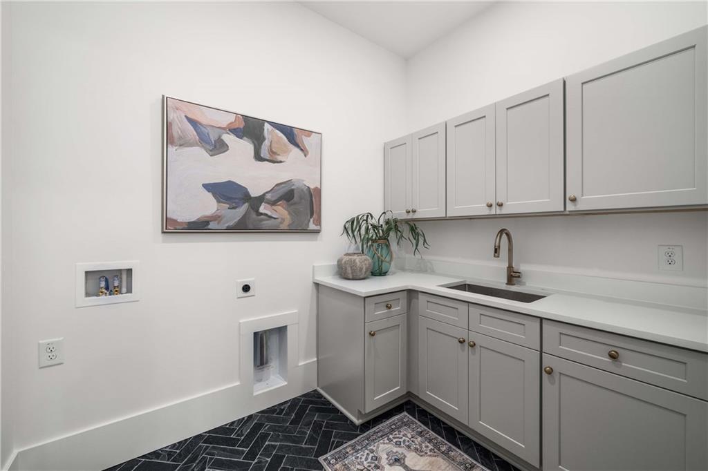 257 Lask Lane Milton, GA 30004 - Photo 22 of 84 a kitchen with a sink and cabinets