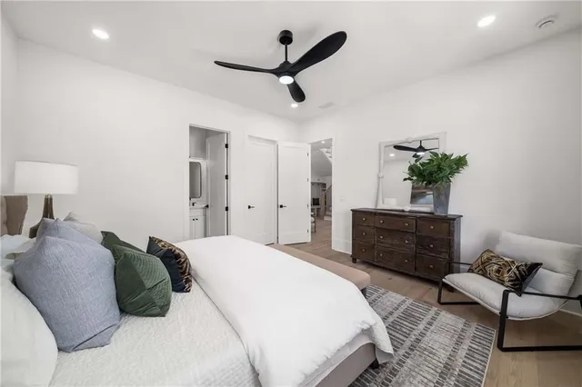 a balcony with wooden floor and outdoor seating