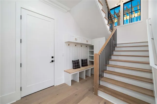a view of an entryway with wooden floor