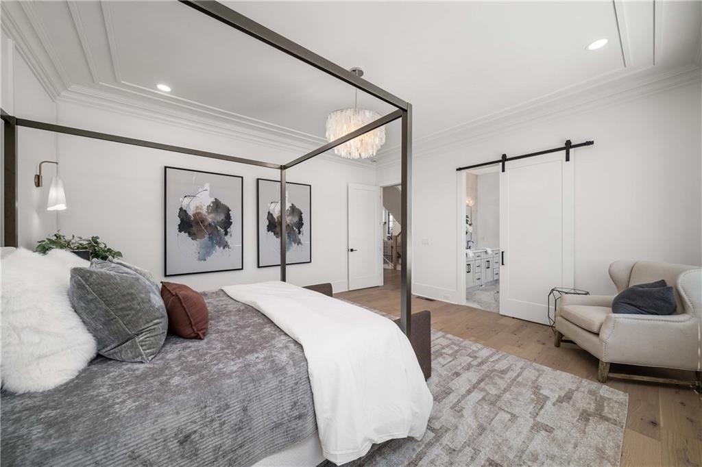 257 Lask Lane Milton, GA 30004 - Photo 30 of 84 a spacious bedroom with a bed and walk in closet