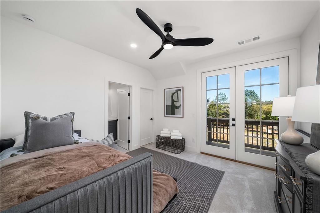 257 Lask Lane Milton, GA 30004 - Photo 35 of 84 a bedroom with a bed and wooden floor