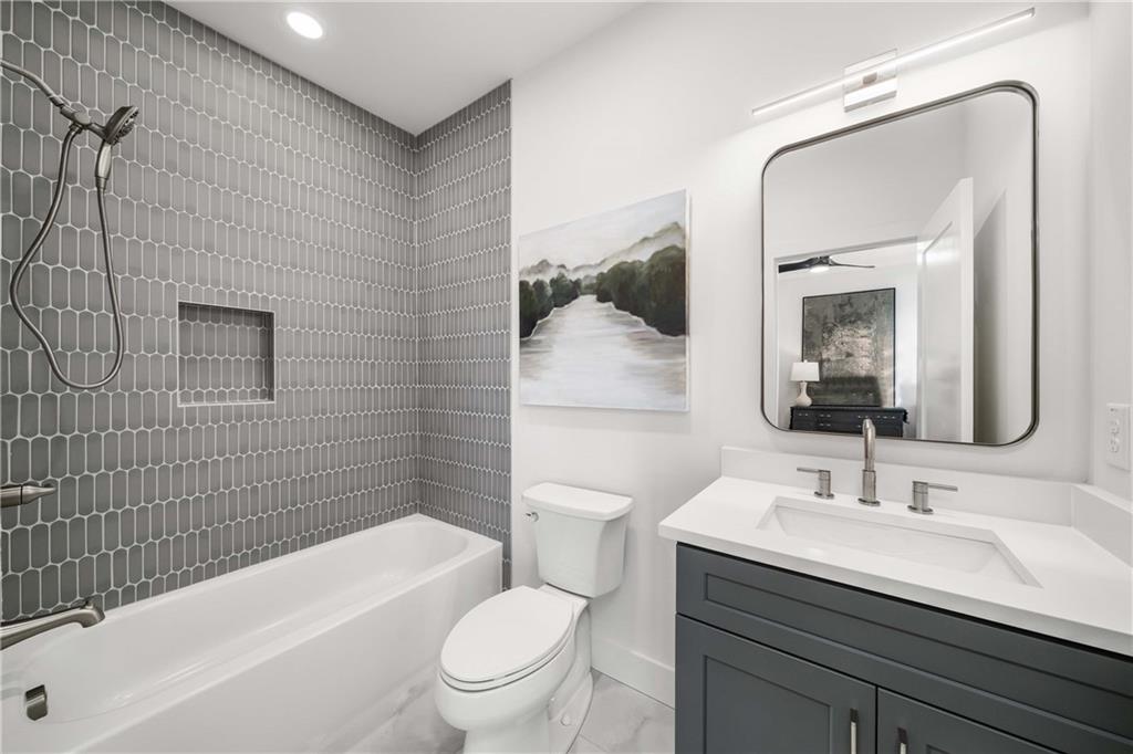 257 Lask Lane Milton, GA 30004 - Photo 36 of 84 a bathroom with a sink a toilet and shower