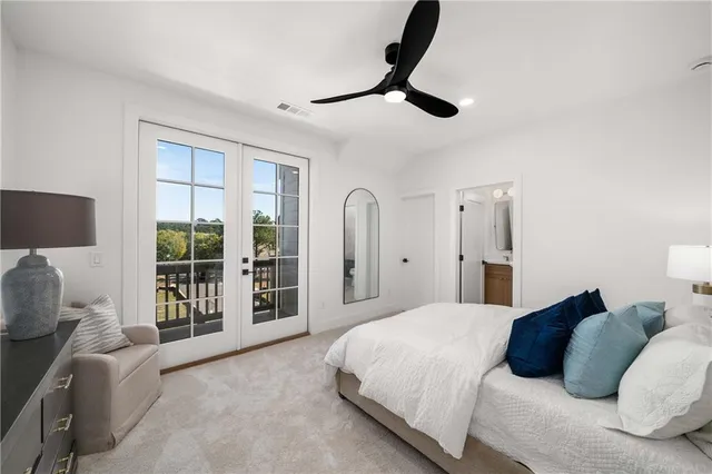 a view of a brick house with fountain in front of it