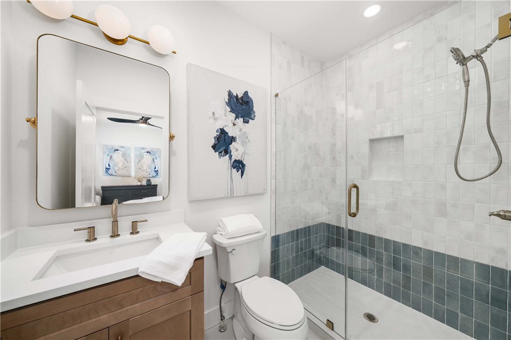 257 Lask Lane Milton, GA 30004 - Photo 40 of 84 a bathroom with a sink a toilet and shower