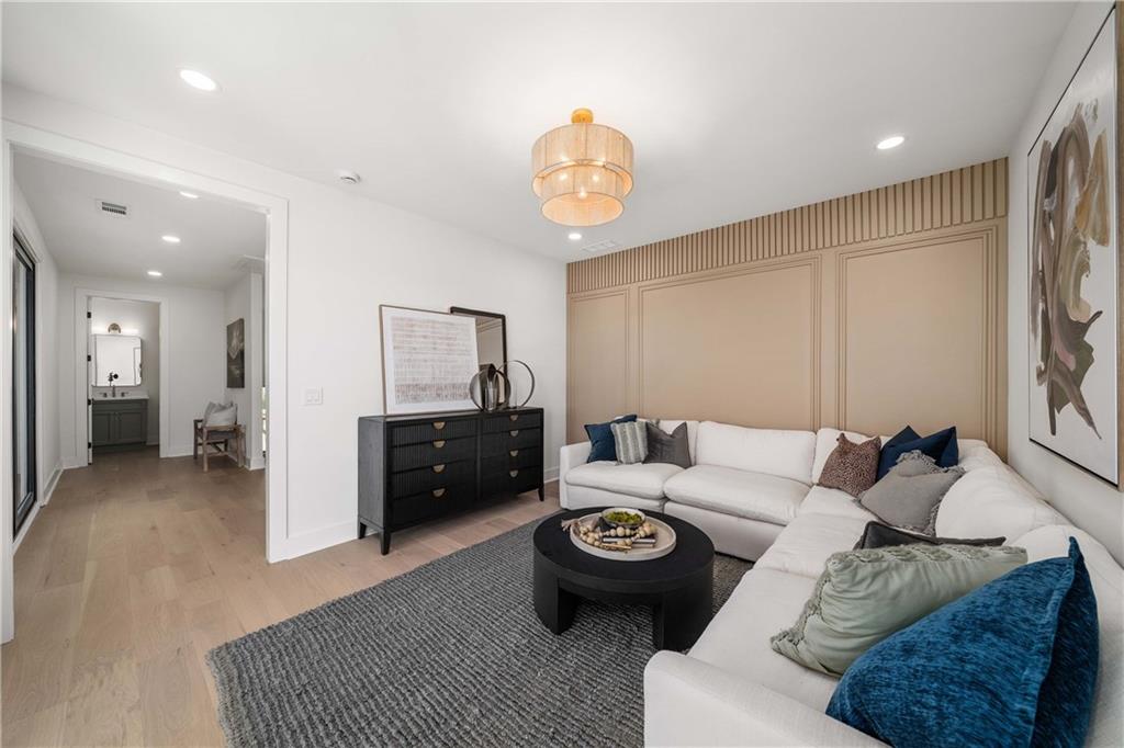 257 Lask Lane Milton, GA 30004 - Photo 45 of 84 a living room with furniture and a flat screen tv