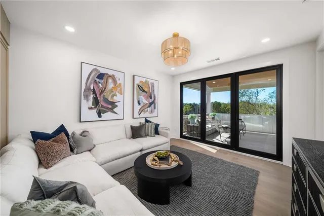 a front view of building with yard and outdoor seating