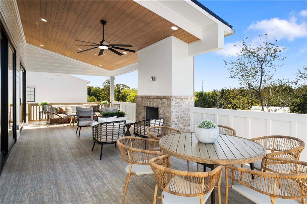 257 Lask Lane Milton, GA 30004 - Photo 48 of 84 a outdoor space with patio the couches and a fireplace