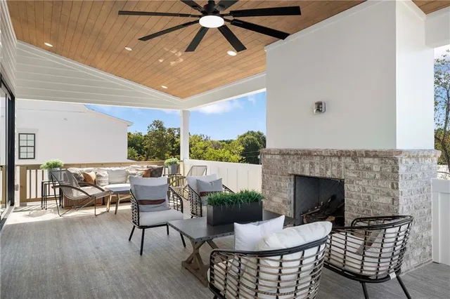 an aerial view of a city with lots of residential buildings ocean and mountain view in back