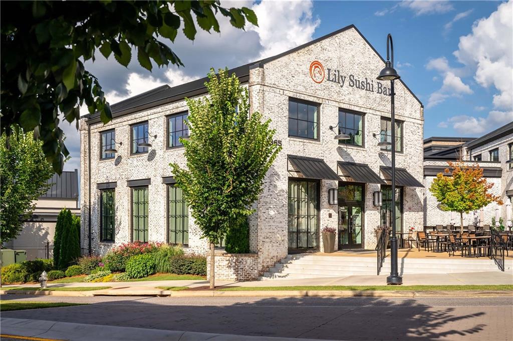 257 Lask Lane Milton, GA 30004 - Photo 66 of 84 a view of a brick house with fountain in front of it