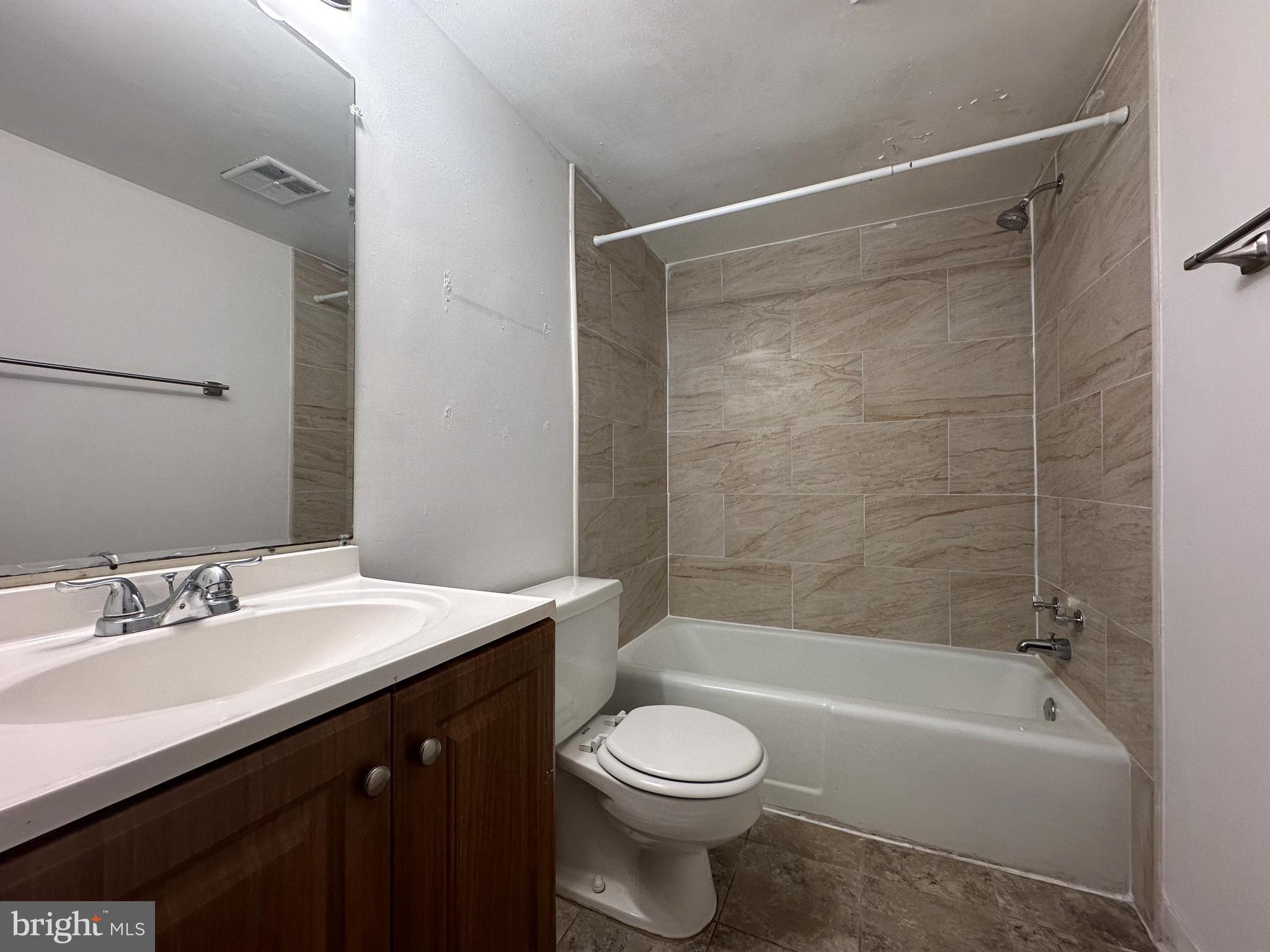1532 Northgate Square, Unit 15322A Reston, VA 20190 - Photo 15 of 16 a bathroom with a sink a toilet and a bathtub