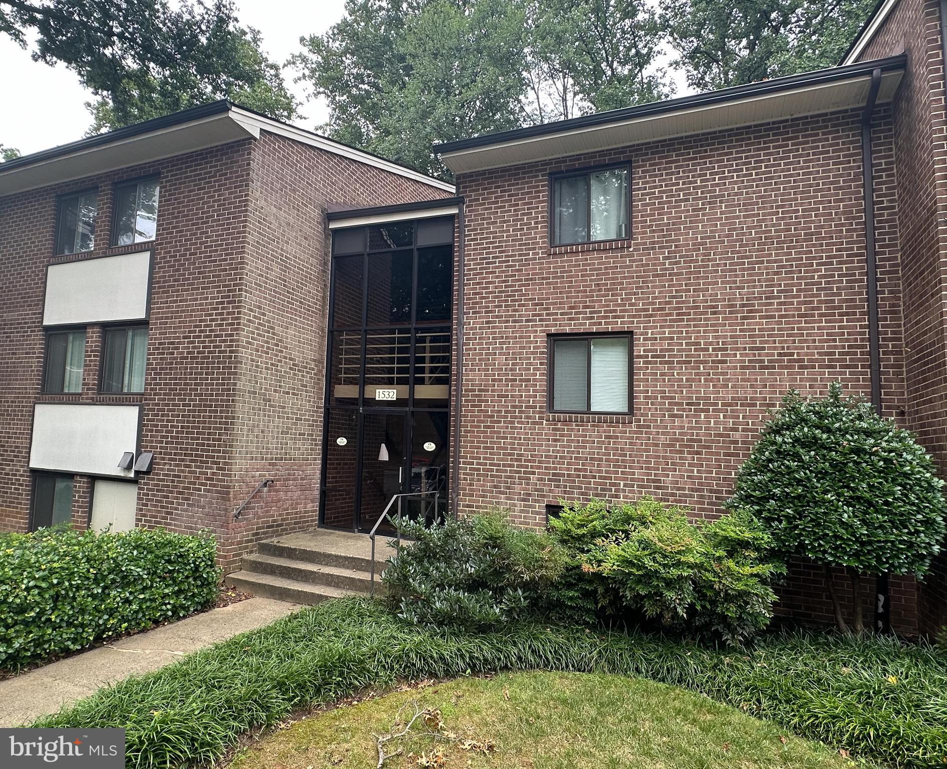 1532 Northgate Square, Unit 15322A Reston, VA 20190 - Photo 2 of 16 a front view of a house with garden