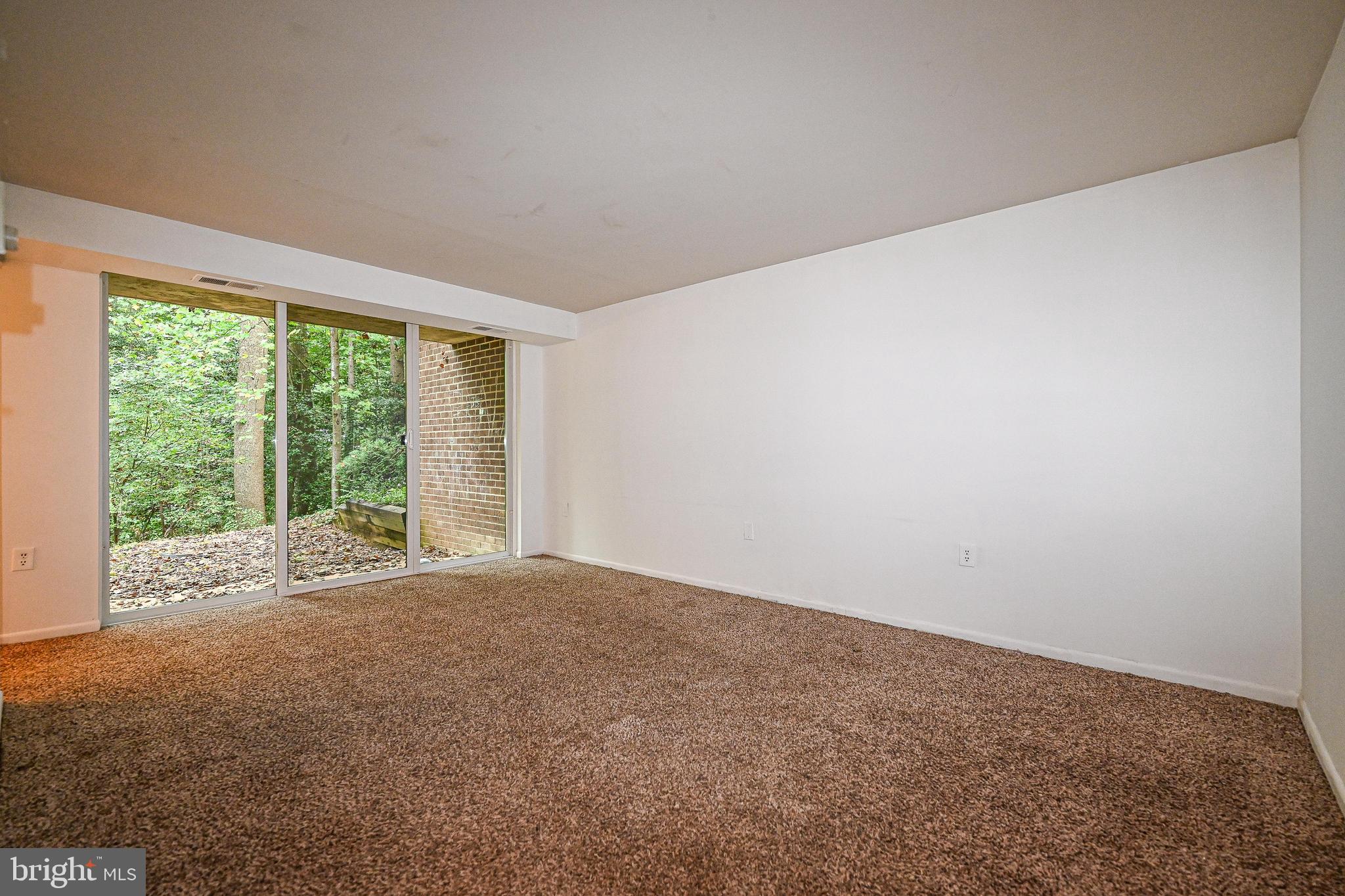 1532 Northgate Square, Unit 15322A Reston, VA 20190 - Photo 3 of 16 a view of an empty room with large windows