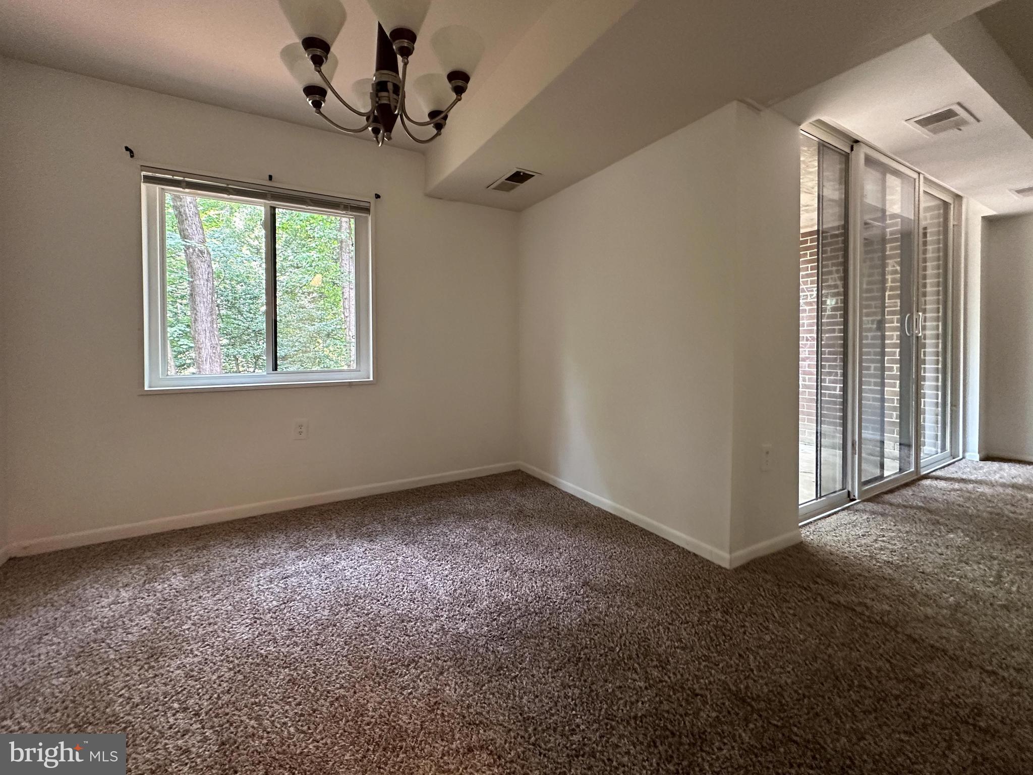 1532 Northgate Square, Unit 15322A Reston, VA 20190 - Photo 4 of 16 a view of an empty room with a window