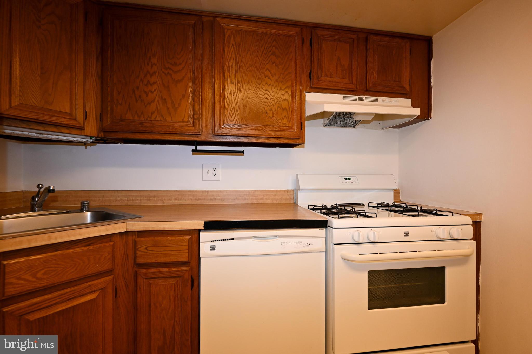 1532 Northgate Square, Unit 15322A Reston, VA 20190 - Photo 9 of 16 a view of a kitchen with washer and dryer