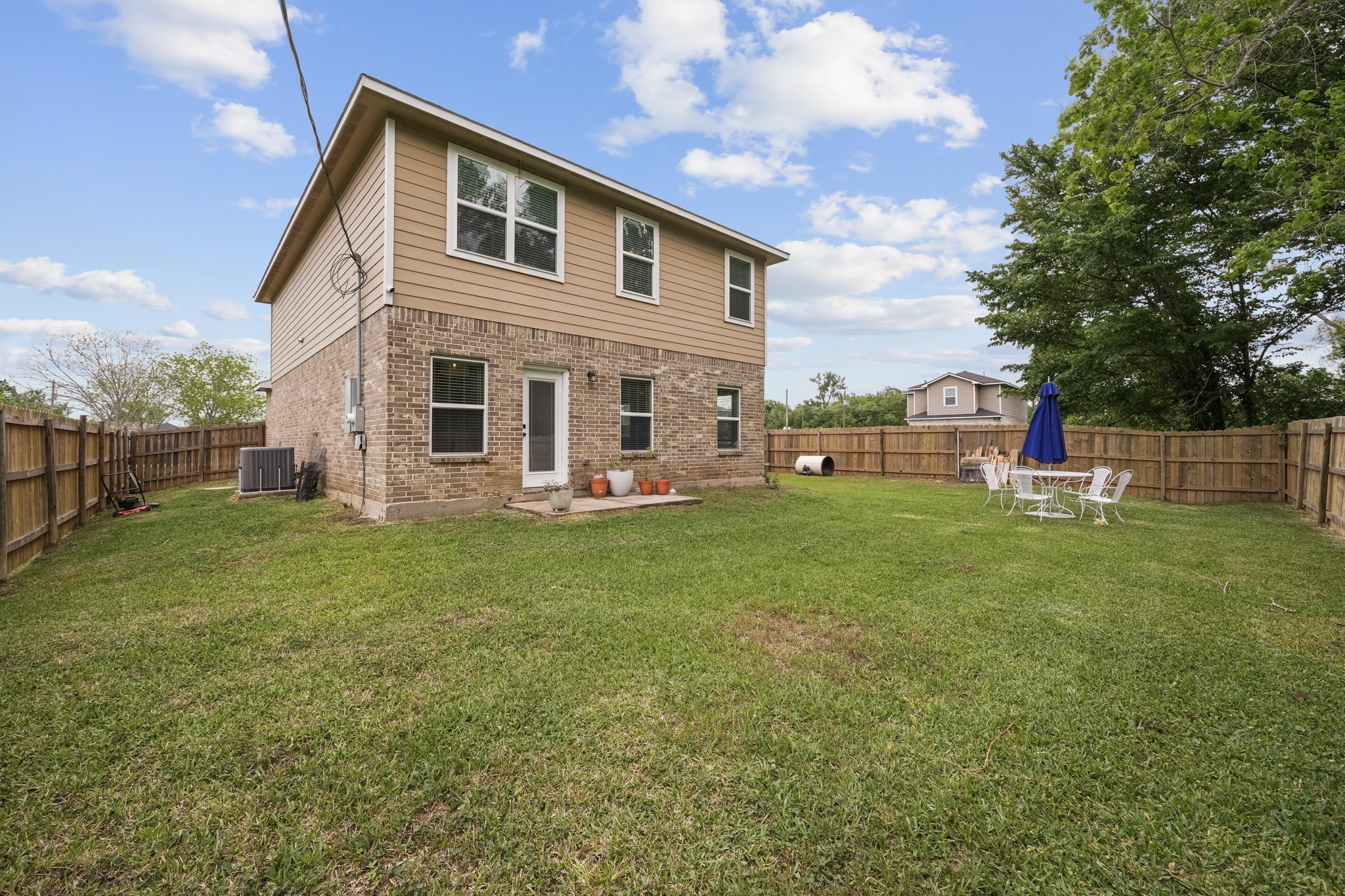6101 Fox Ridge Drive Angleton, TX 77515 - Photo 29 of 30 a front view of house with yard and outdoor seating