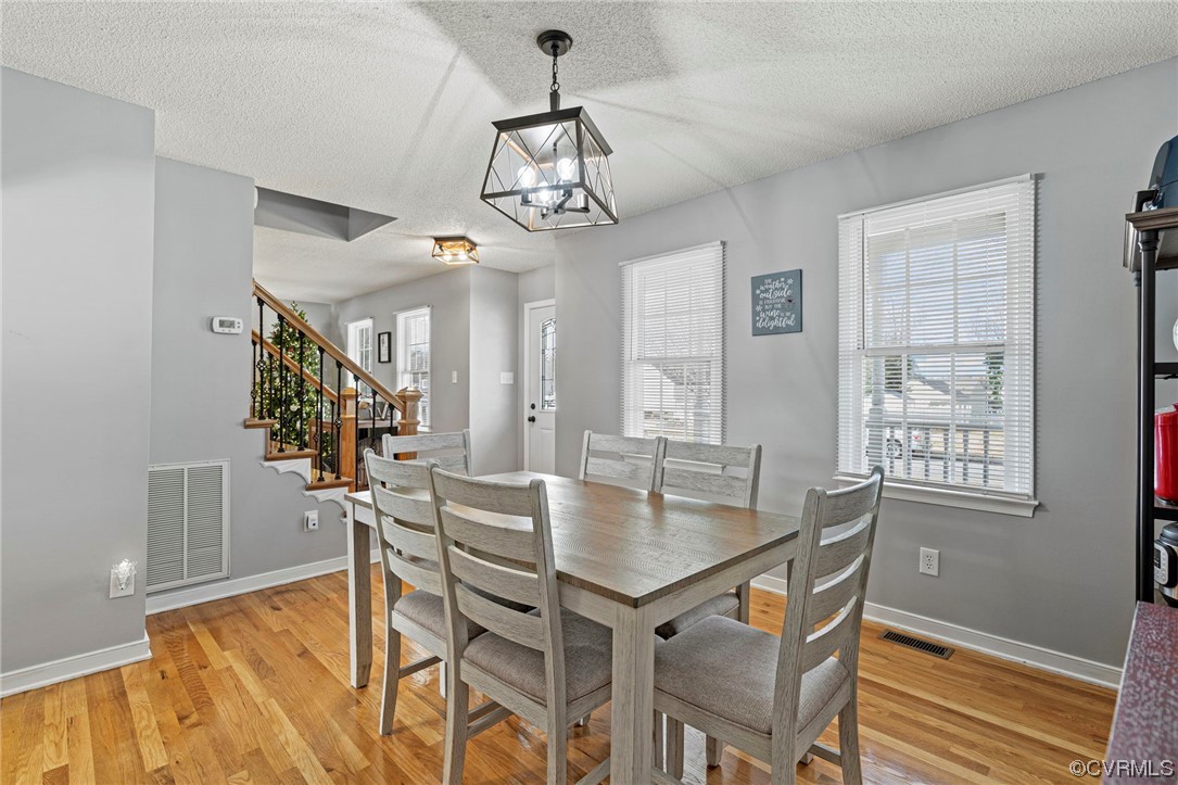 6441 Blair Court Prince George, VA 23875 - Photo 18 of 46 a view of a dining room with furniture window and wooden floor