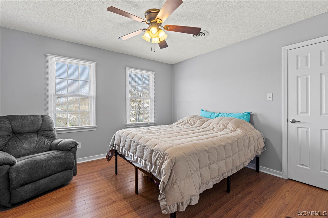 6441 Blair Court Prince George, VA 23875 - Photo 21 of 46 a bedroom with a bed couch and window