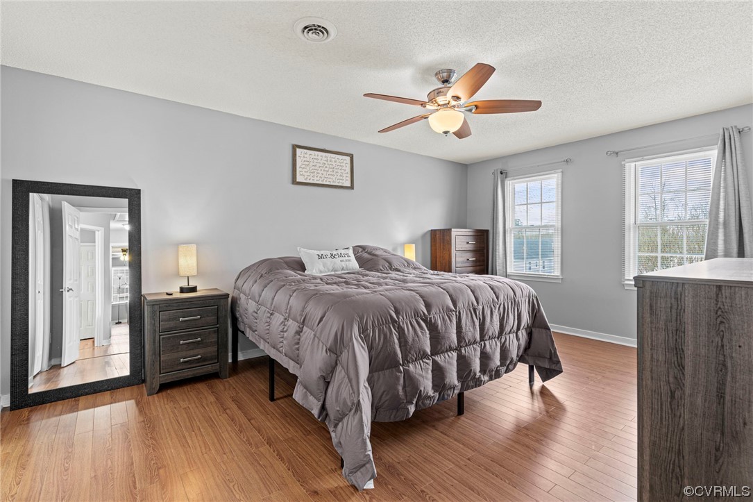 6441 Blair Court Prince George, VA 23875 - Photo 24 of 46 a bedroom with a bed and wooden floor