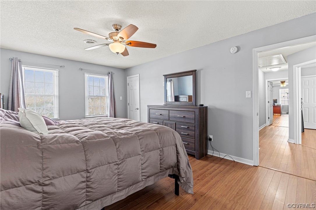6441 Blair Court Prince George, VA 23875 - Photo 28 of 46 a bedroom with a bed and a chandelier