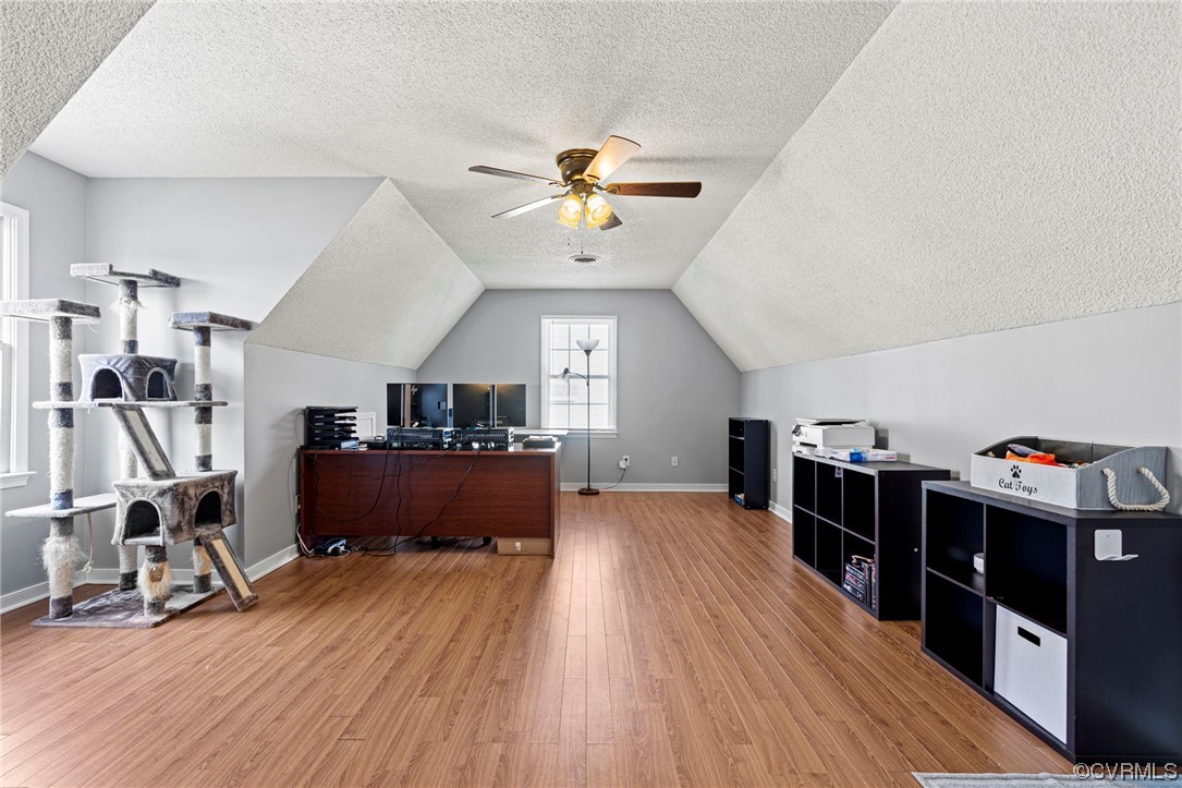 6441 Blair Court Prince George, VA 23875 - Photo 32 of 46 a living room with hard wood flooring and a couch
