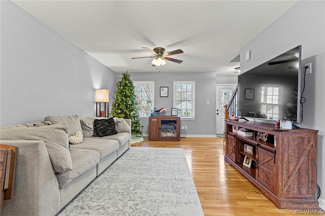6441 Blair Court Prince George, VA 23875 - Photo 8 of 46 a living room with furniture and a flat screen tv